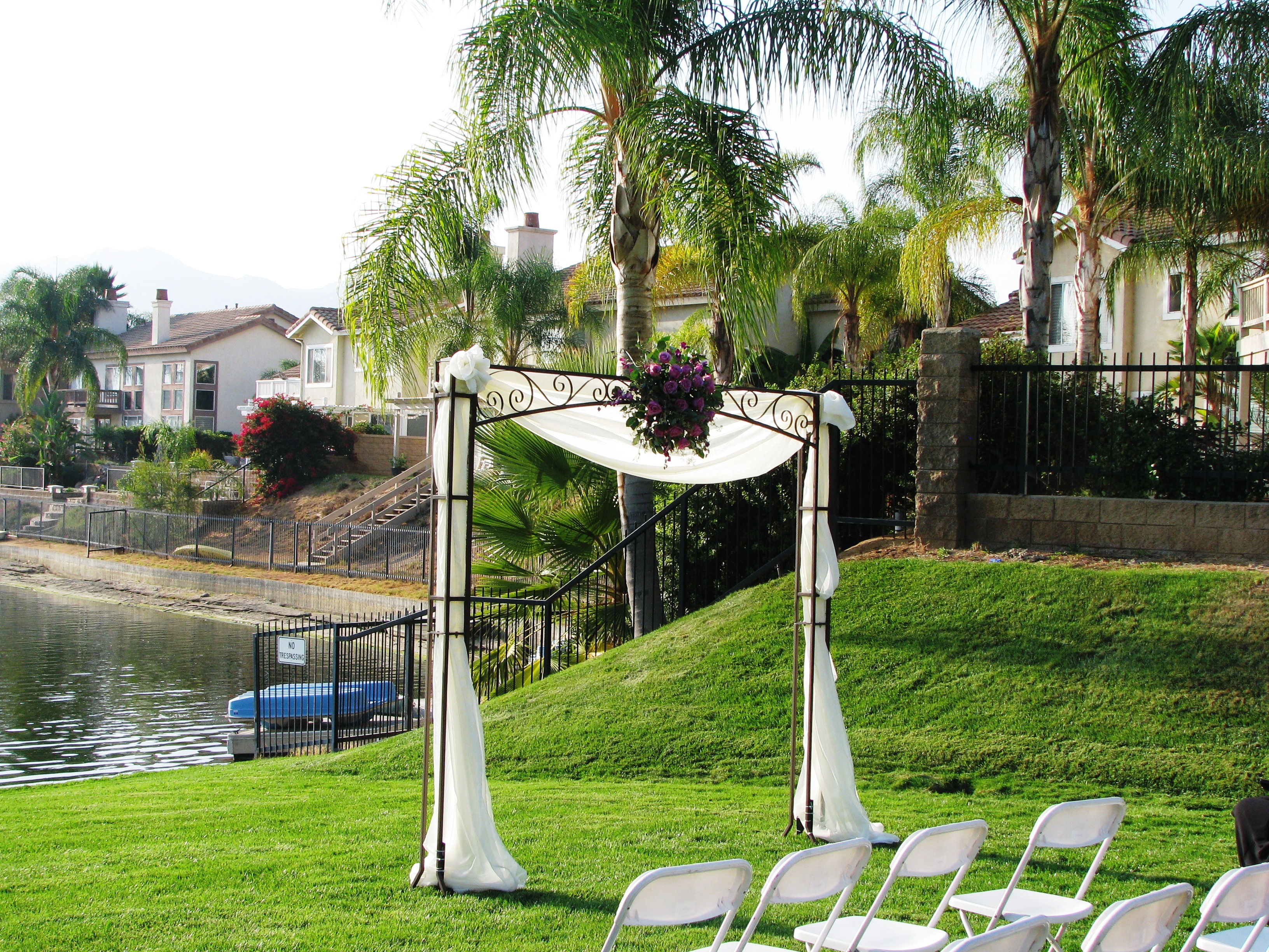 Iron square arch with draping and flower